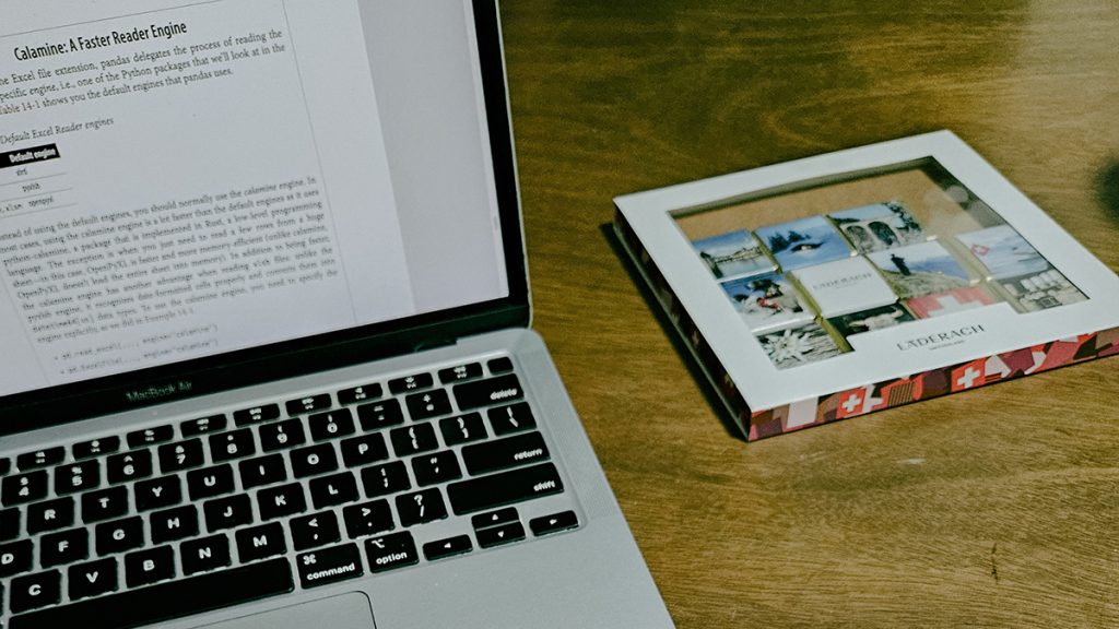 An open laptop on a wooden table